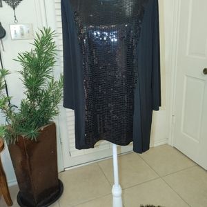 A black Joan Rivers sequins shirt..